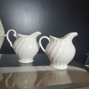Small ceramic pitchers. 5x5
